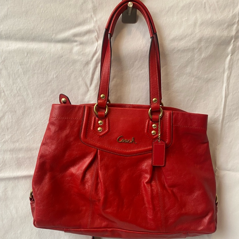 Red Coach handbag with shoulder strap